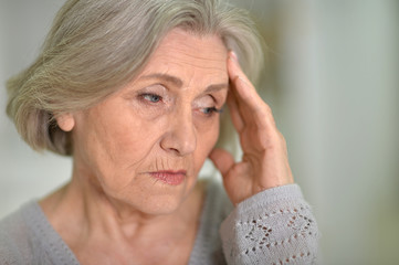 Beautiful sad elderly woman close-up