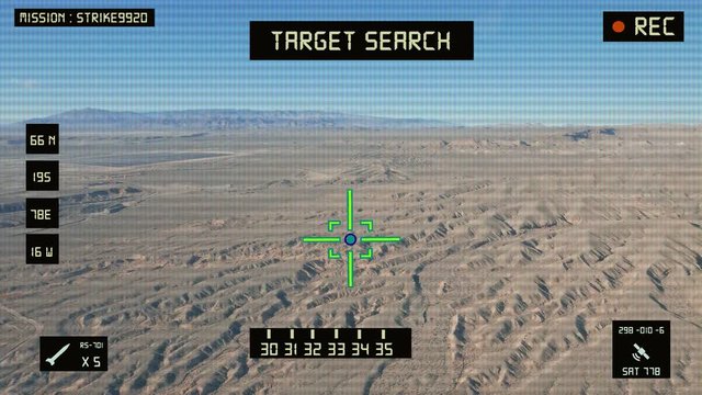 Viewfinder of a military helicopter / plane looking for a target to shoot and bomb. Desert area.