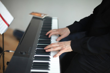 Fototapeta na wymiar Close up of man hands classic piano playing