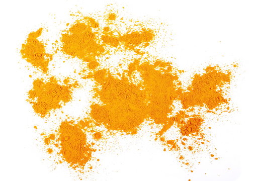Turmeric (Curcuma) powder isolated on white background, top view
