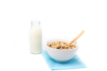 Delicious and healthy cereal in bowl with milk. Morning breakfast isolated on white background