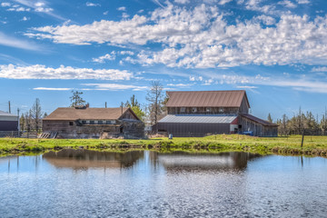 Fototapeta premium Reflection of barn on pond