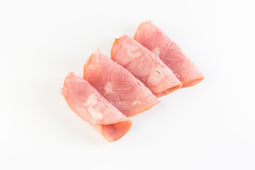 Fresh sliced smoked ham isolated on white background