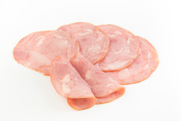 Fresh sliced smoked ham isolated on white background