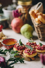Snack from crackers and beets, honey, cheese