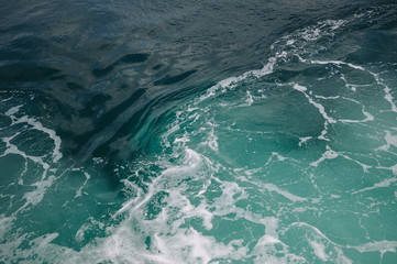 Sea foam and waves on the water