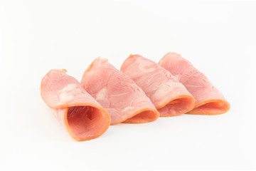 Fresh sliced smoked ham isolated on white background