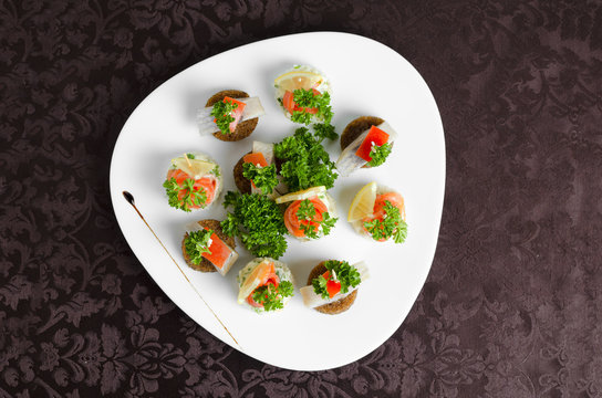 Fish Canapes On A White Plate