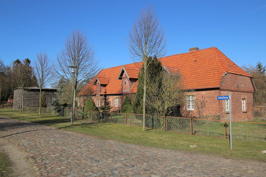 Former foal stable on palace grounds in Griebenow, Mecklenburg-Vorpommern, Germany. The street name sign says Schlossweg - Palace way