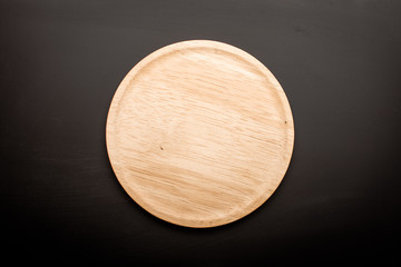 empty wooden plate  wood texture background can use to pizza on plate and copy space etc.;