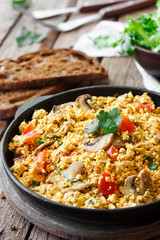 Tofu scrambled with mushrooms and tomatoes
