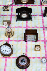 Old retro vintage clocks on the floor