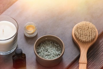SPA beauty cosmetic products from above on dark stone table. Professional salon massage concept. Copyspace