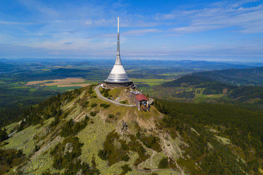 Aerial view of Jested tower on the top of Jested mountain 1 012 m (3,320 ft). Famous tourist attraction near Liberec in Czech republic, Europe. TV broadcast tower was built between 1963 and 1968.