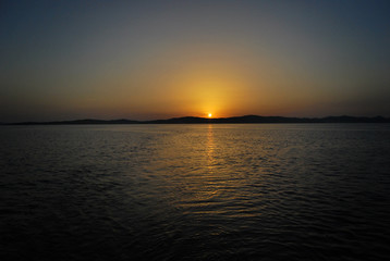 Yachting yacht sailboat sailing in adriatic sea at sunset sunrise summer vacation. Tourism luxury lifestyle.