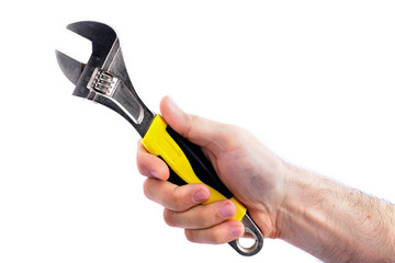 man's hand hold adjustable wrench with yellow handle isolated on white background