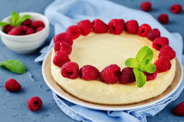Cheesecake with fresh raspberries and mint