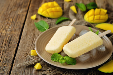 Creamy mango ice cream with fruits and ices