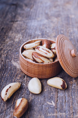 Brazil nuts on the old wooden background