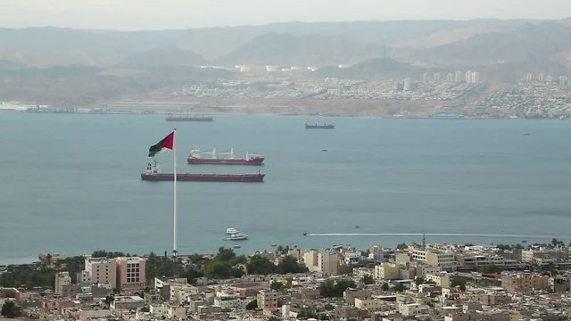 View of Aqaba city in Jordan and Eilat city in Israel. View from mountain in Aqaba city in Jordan. Two city and two country in one video clip