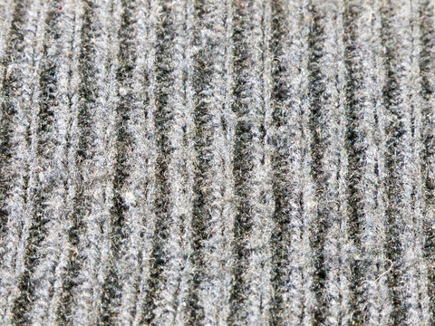 Close Up Texture Of Bottom Of Blue Jumper Ribbed Cotton