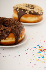 donuts on a plate on a white background