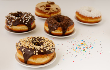 Fototapeta premium donuts on a plate on a white background
