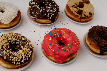 donuts on a plate on a white background