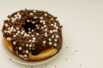 donut on a plate on a white background