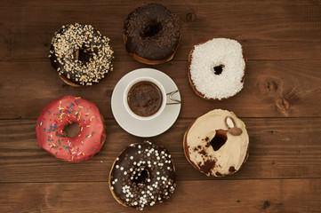 donuts and coffee on a wooden table