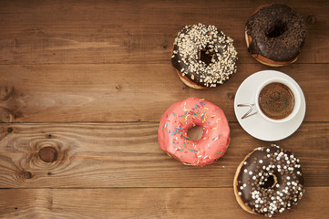 donuts and coffee on a wooden table