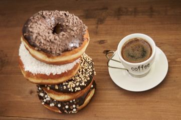 donuts and coffee on a wooden table