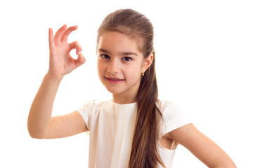 Little girl in white T-shirt and black skirt