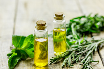 homemade spa with herbal extract in oil on wooden table background