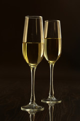 Glass with white, red wine and cognac or whisky on mirror table. Celebrities composition. selective focus