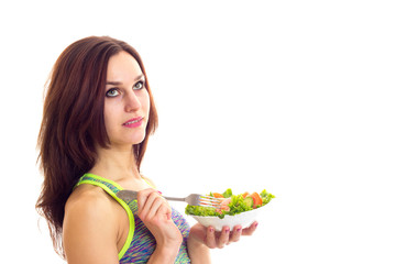 Sportive woman holding salad 