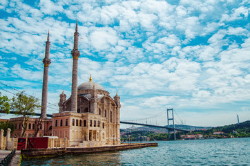 Mosque and Bosporus in Istanbul, Turkey. Architectural monument. Center of Islam. Cami. Mescit. Sky and clouds on the background. Marble sea or Sea of Marmara on horizon. Panorama view.