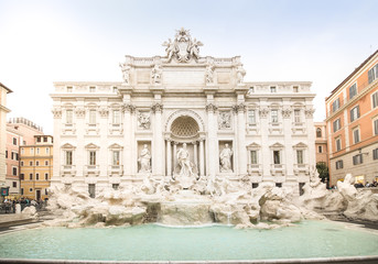 Fototapeta na wymiar Trevi fountain at sunrise, Rome, Italy. Rome baroque architecture and landmark. Rome Trevi fountain is one of the main attractions of Rome and Italy