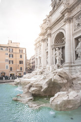 Fototapeta na wymiar Trevi fountain at sunrise, Rome, Italy. Rome baroque architecture and landmark. Rome Trevi fountain is one of the main attractions of Rome and Italy