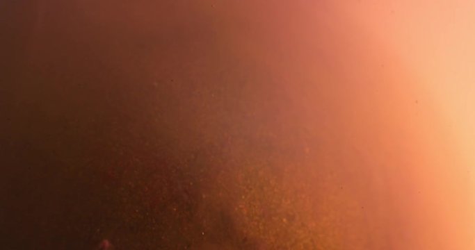 Abstract spherical models made of plasticine, immersed in liquid. Closeup. 4K. Camera RED.
