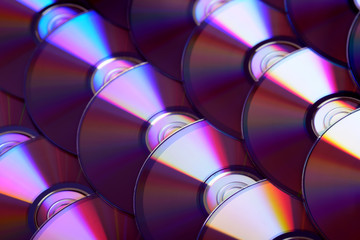 Compact discs background. Several cd dvd blu-ray discs. Optical recordable or rewritable digital...