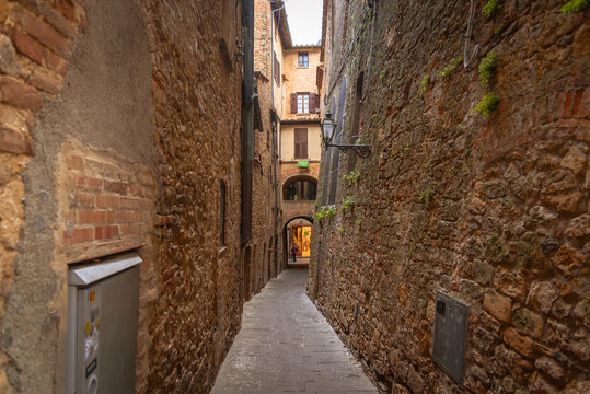  View of a street of the small and famous town of Volterra, Italy.