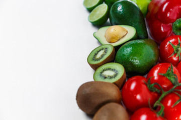 A selection of juicy fruits and vegetables on a white background.