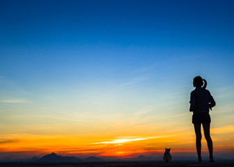 woman with sunset silhouette