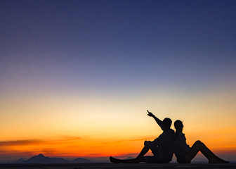 Fototapeta na wymiar Silhouette of couple love outside sunset