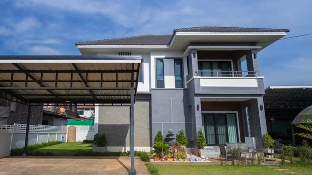 Time-lapse of modern house with sky background