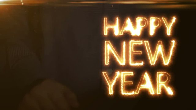 the businessman is projected onto the holographic screen the inscription happy new year.