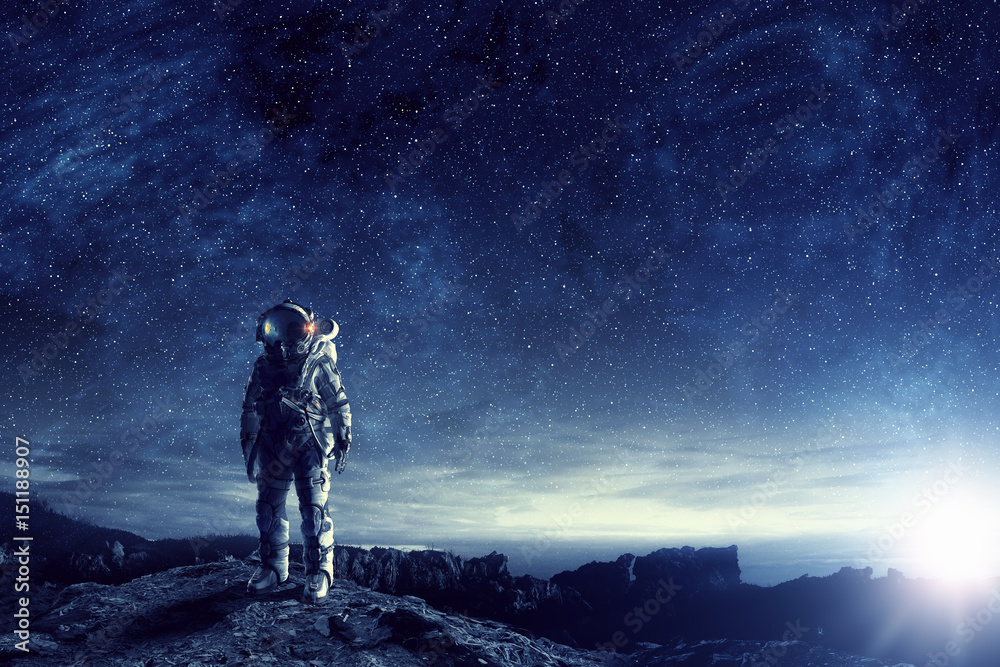 Wall mural astronaut in outer space. mixed media