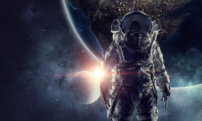 Fototapeta na wymiar Astronaut in outer space. Mixed media