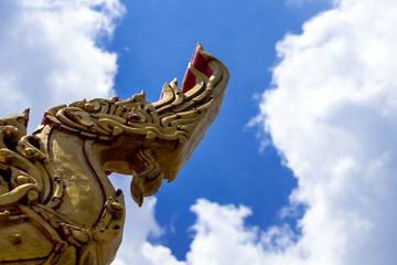 Fototapeta na wymiar Naga head sculpture Decorate at the roof in Thai temple